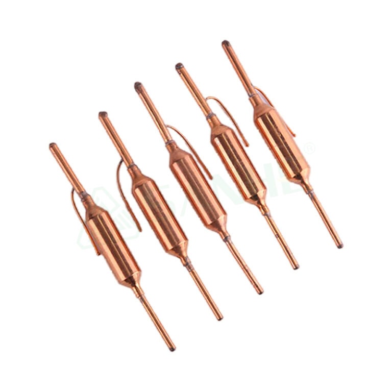 Set of five copper filter driers used in HVAC systems for moisture and debris removal from refrigerant lines.